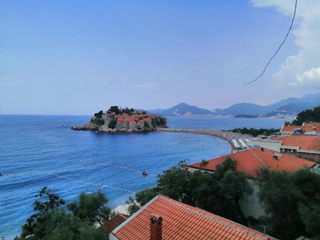 a small island in the middle of the water at Sveti Stefan- Apartment Dora in Sveti Stefan