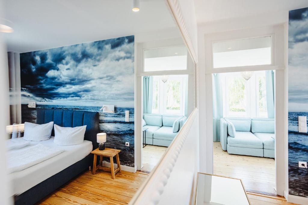 Postel nebo postele na pokoji v ubytování DAS STRANDGLÜCK - Villa und Mee(h)r