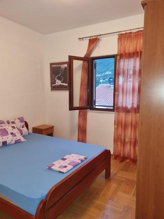 Postel nebo postele na pokoji v ubytování Apartments Sneža