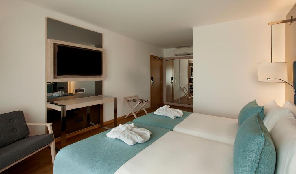 Een bed of bedden in een kamer bij TURIM Presidente Hotel