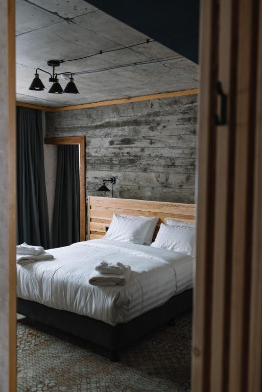 Postel nebo postele na pokoji v ubytování Hotel Posta