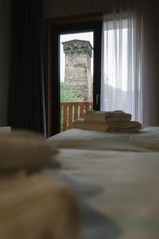 Postel nebo postele na pokoji v ubytování Hotel Posta