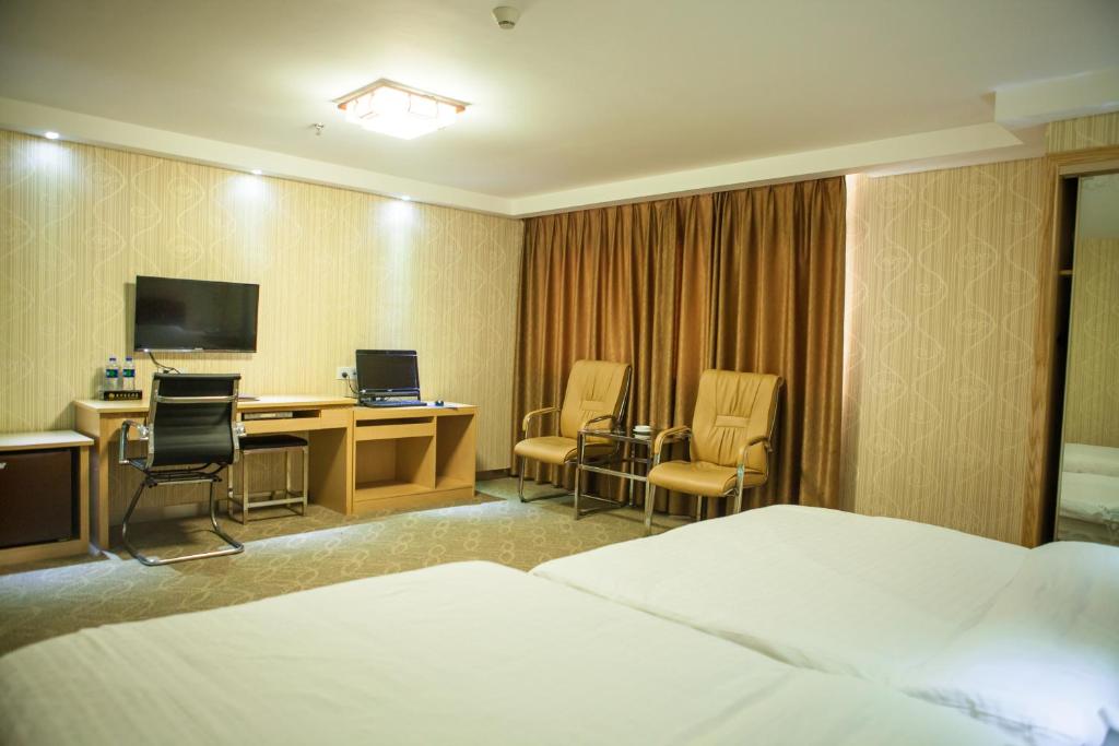 TV a/nebo společenská místnost v ubytování Fuhao Hotel