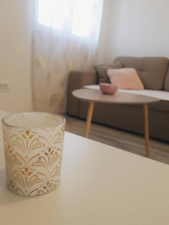 a living room with a couch and a table at Apartment Jovana in Igalo