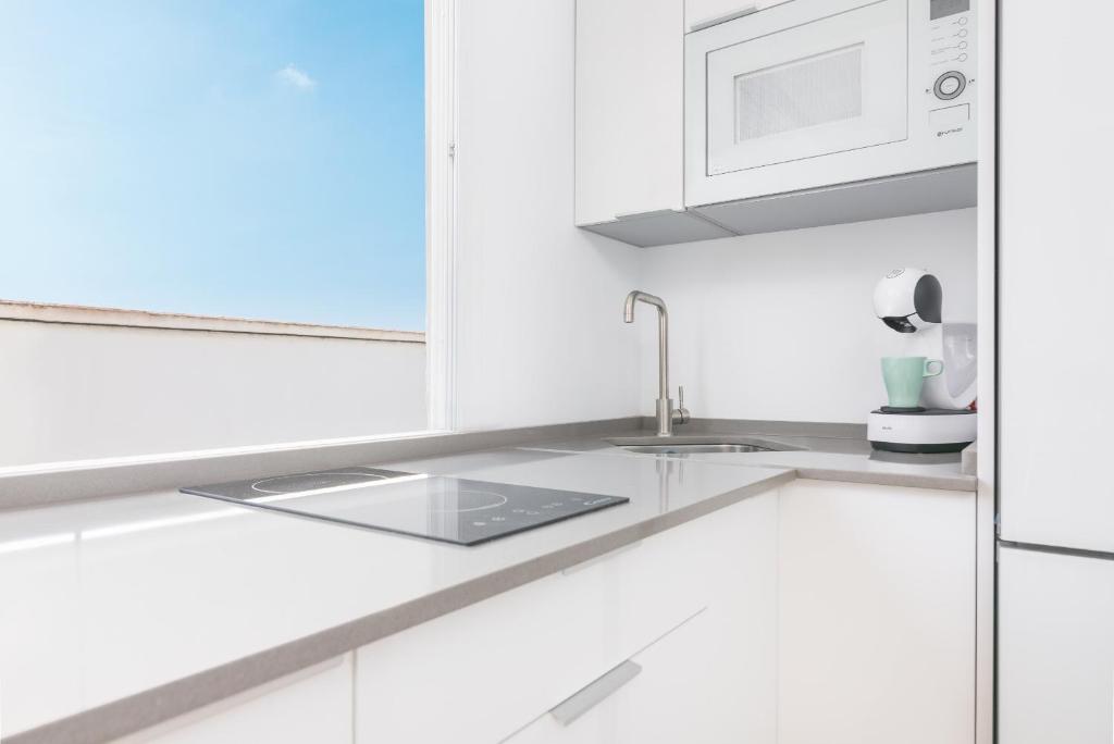 Kuchyňa alebo kuchynka v ubytovaní Suite Homes Penthouse La Merced