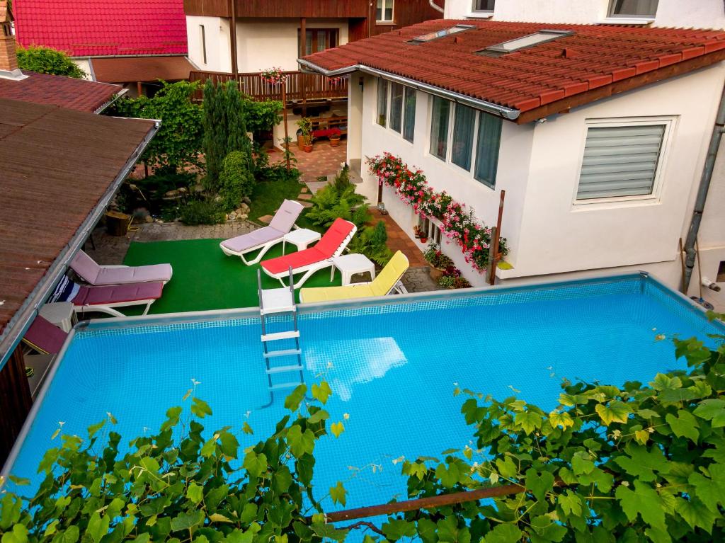 an overhead view of a swimming pool in a backyard at Casa Steluta in Sighişoara