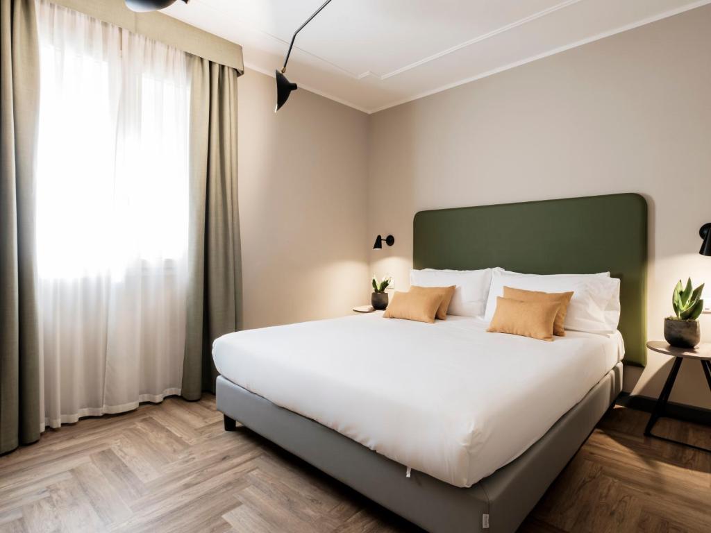 Postel nebo postele na pokoji v ubytování Hotel Lory