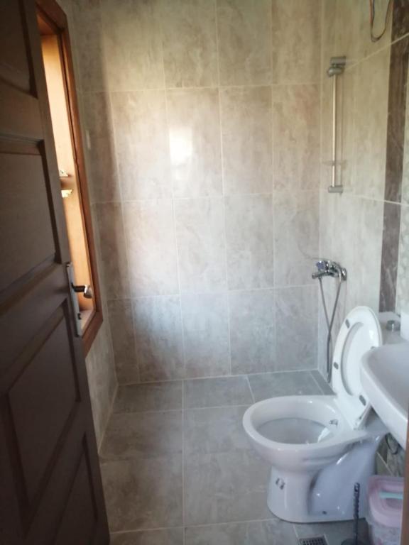 a bathroom with a toilet and a sink at PORT APART in Antalya