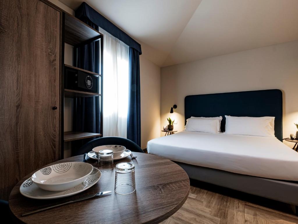 Postel nebo postele na pokoji v ubytování Hotel Lory