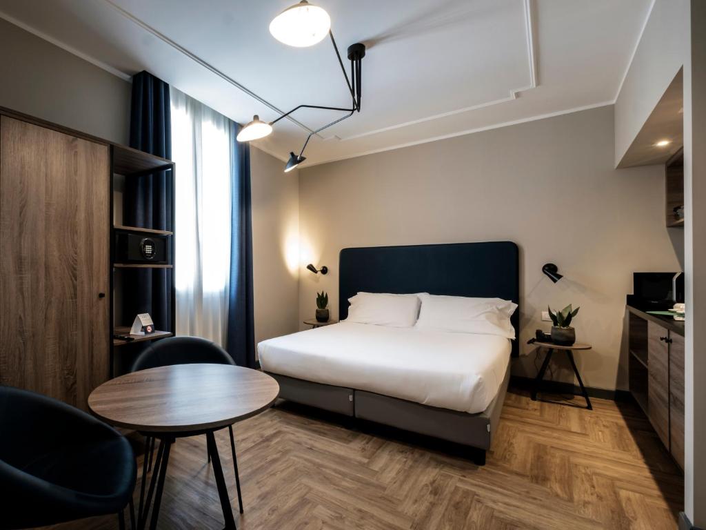 Postel nebo postele na pokoji v ubytování Hotel Lory