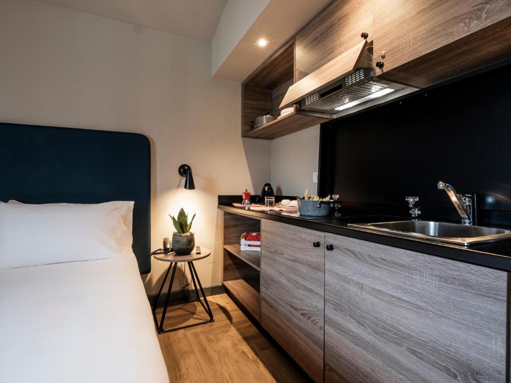 Postel nebo postele na pokoji v ubytování Hotel Lory