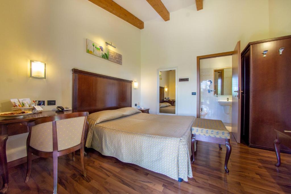 Posteľ alebo postele v izbe v ubytovaní Hotel Regio