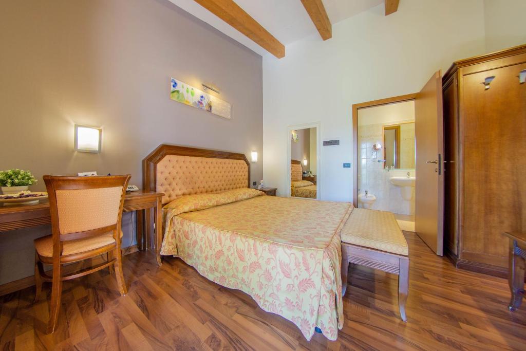 Posteľ alebo postele v izbe v ubytovaní Hotel Regio