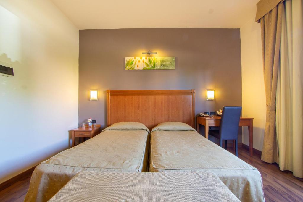 Posteľ alebo postele v izbe v ubytovaní Hotel Regio