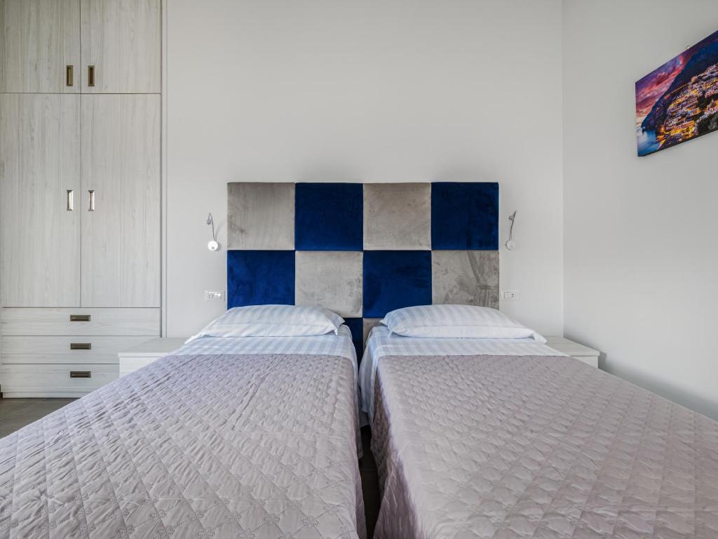 Posteľ alebo postele v izbe v ubytovaní Azzurro Park Suite - De Vivo Realty Sorrento