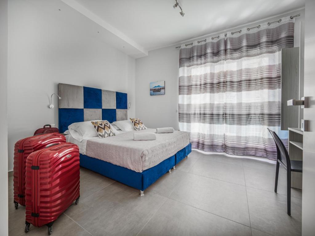 Postel nebo postele na pokoji v ubytování Azzurro Park Suite SORRENTO