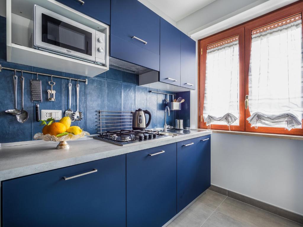 Kuchyňa alebo kuchynka v ubytovaní Azzurro Park Suite - De Vivo Realty Sorrento