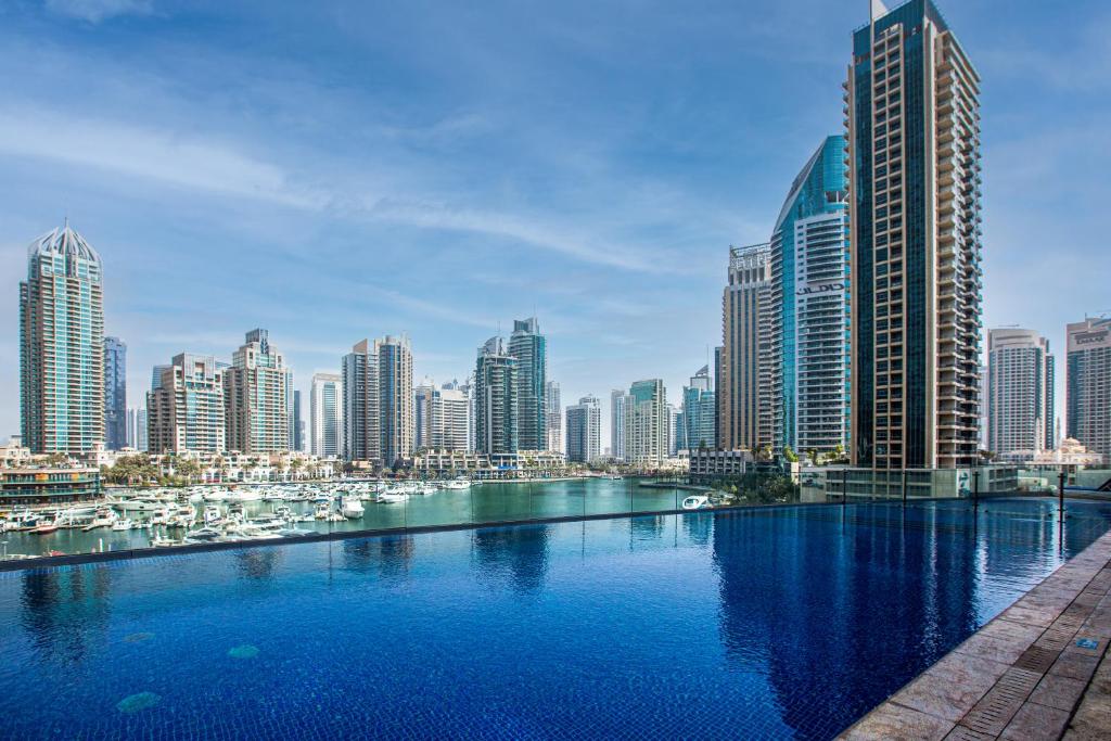 a view of a city with tall buildings at Cayan Tower, Dubai Marina in Dubai