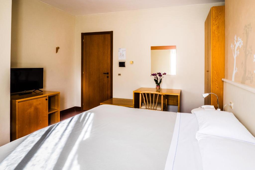 Postel nebo postele na pokoji v ubytování Al Vecchio Palazzo