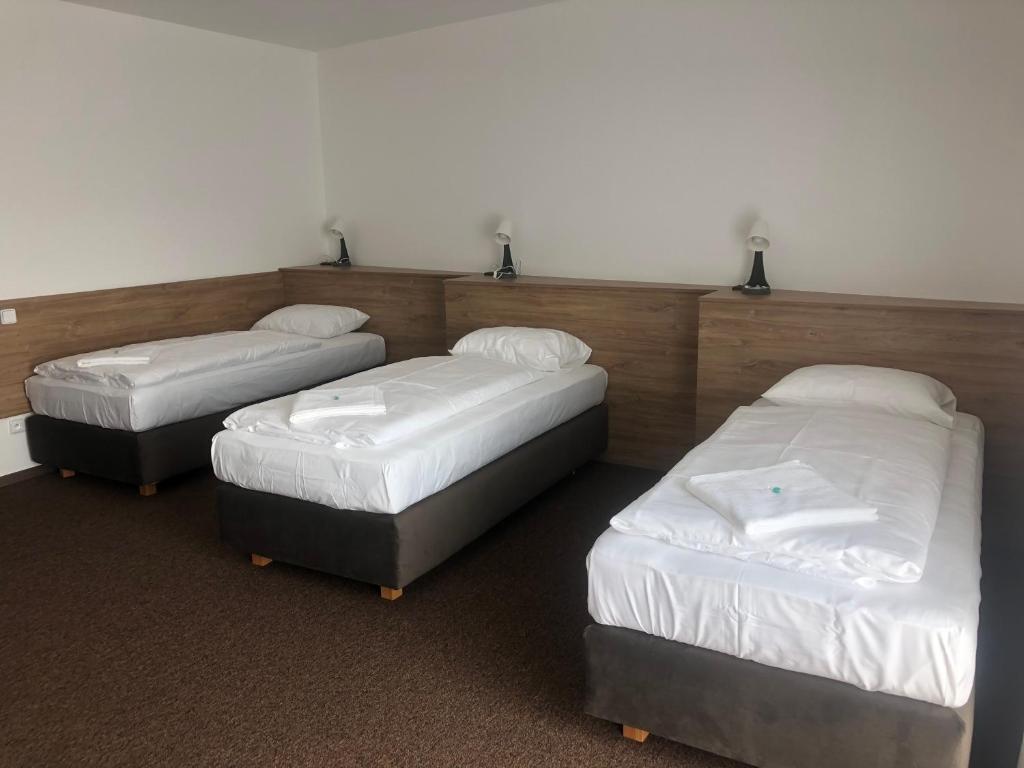 Postel nebo postele na pokoji v ubytování Motel R10