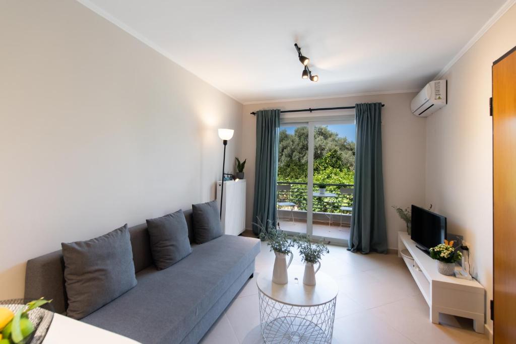 a living room with a couch and a table at La Strada Apartment in Lefkada