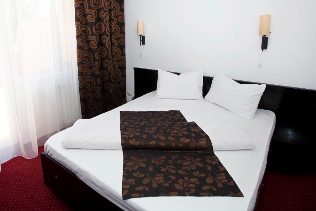 Postel nebo postele na pokoji v ubytování Hotel Terra
