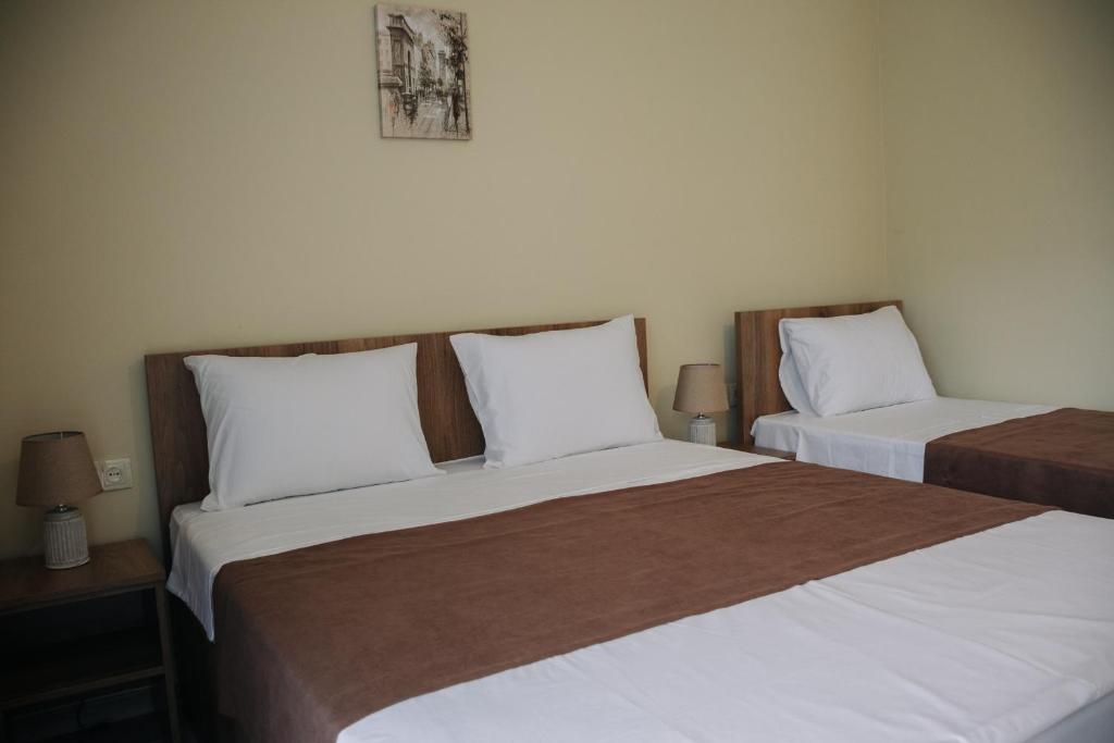 Postel nebo postele na pokoji v ubytování Scorpio Hotel Gonio