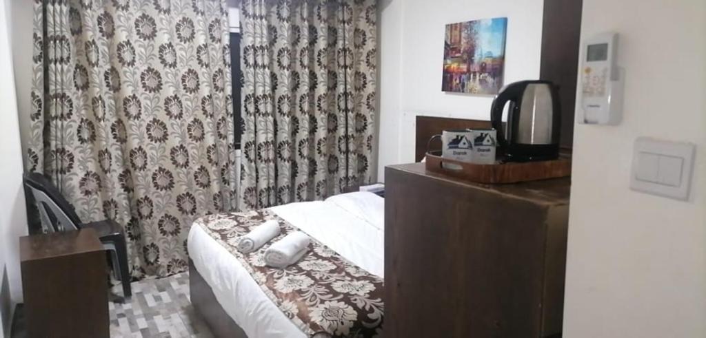 Postel nebo postele na pokoji v ubytování Darak hotel