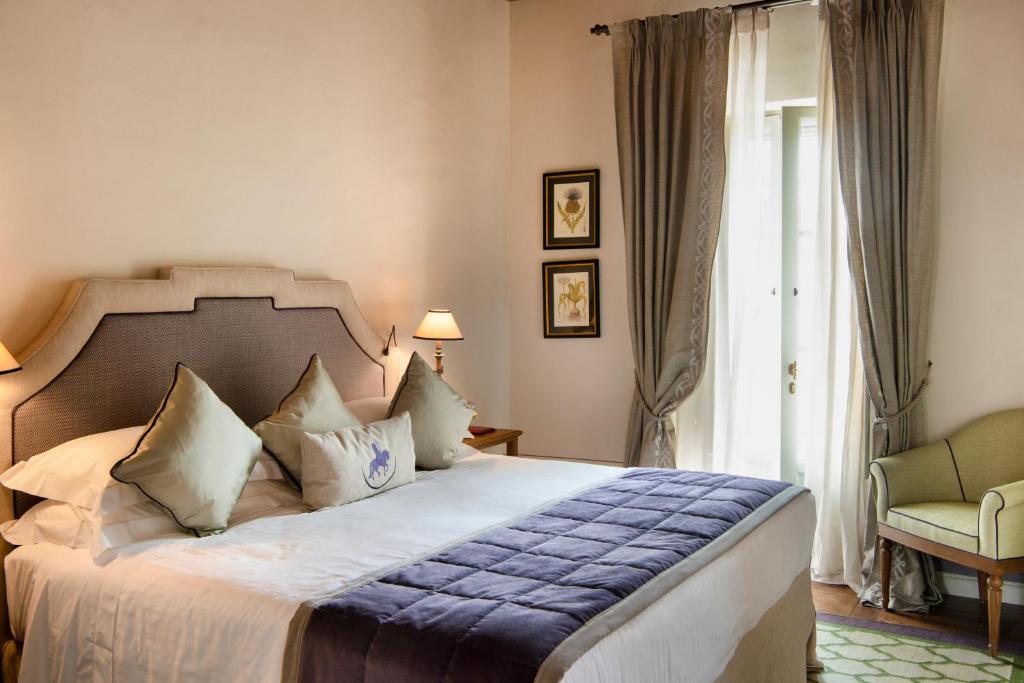 Postel nebo postele na pokoji v ubytování Borgo San Felice Resort