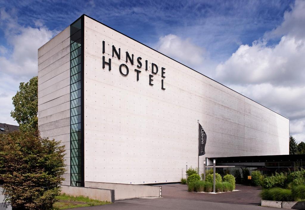 a building with an inside motel sign on it at INNSiDE by Meliá Düsseldorf Seestern in Düsseldorf