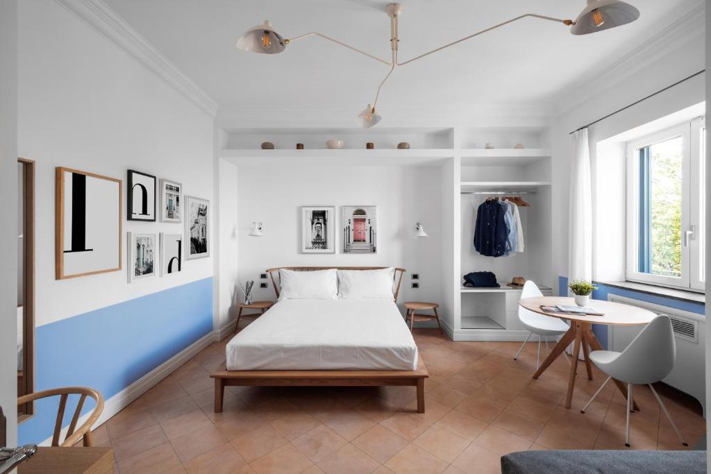 Postel nebo postele na pokoji v ubytování Sorrento & Else - Deluxe Apartments