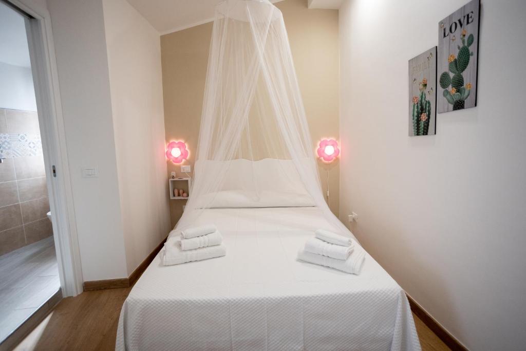 Letto o letti in una camera di EXCLUSIVE ROOMS Al Vicoletto