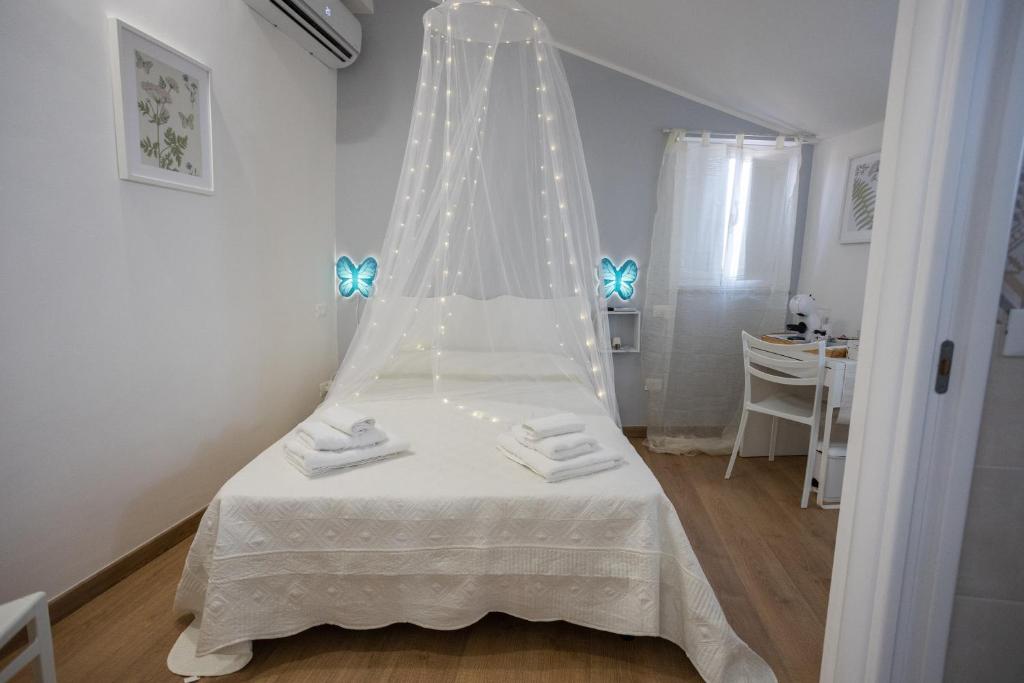 Letto o letti in una camera di EXCLUSIVE ROOMS Al Vicoletto
