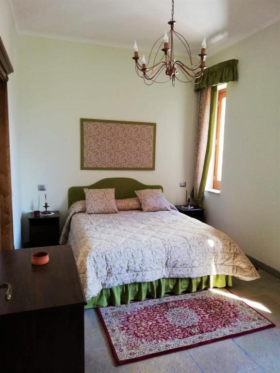 Postel nebo postele na pokoji v ubytování Relais Country House