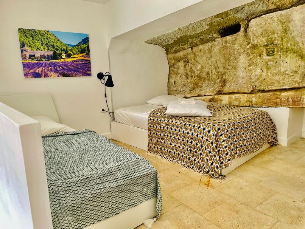 Postel nebo postele na pokoji v ubytování VILLA BEL - Entre paradis et vignes