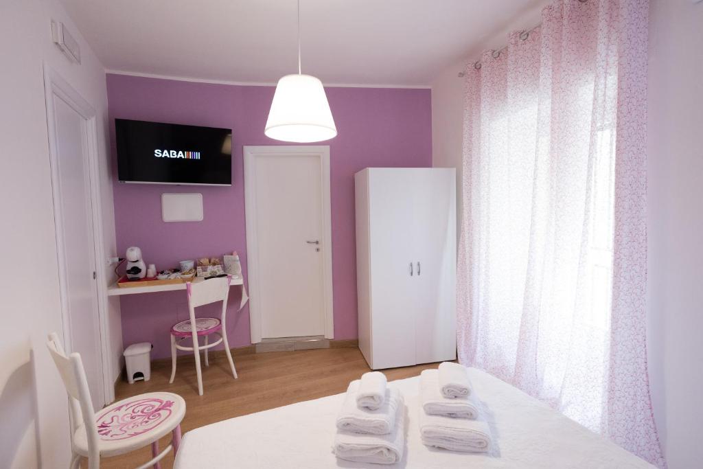 Letto o letti in una camera di EXCLUSIVE ROOMS Al Vicoletto