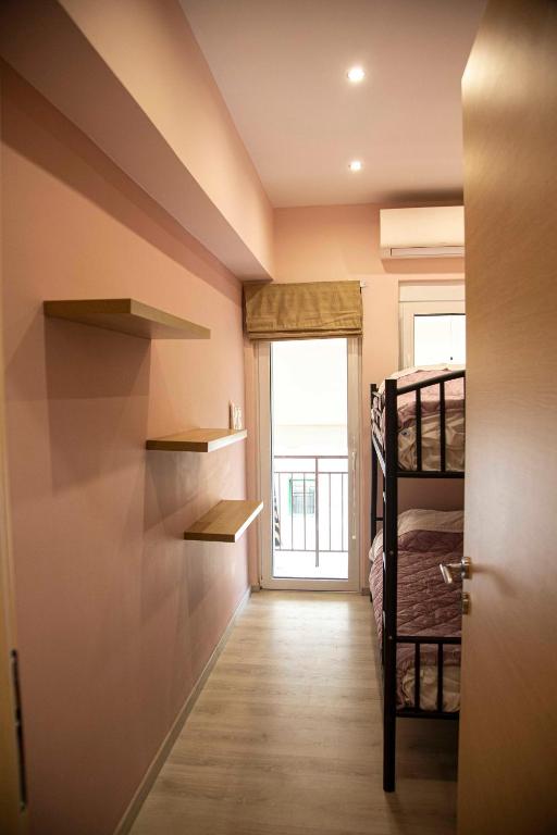Postel nebo postele na pokoji v ubytování Athens Nautical Flat