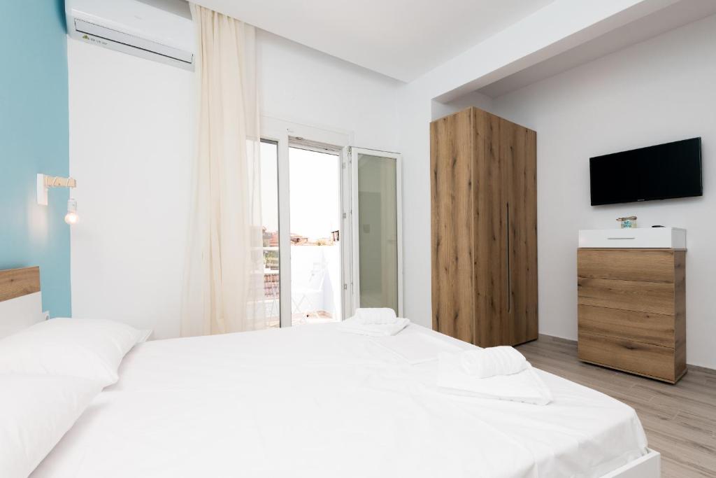 Postel nebo postele na pokoji v ubytování Diamanti Apartments Downtown Limenas Thasos