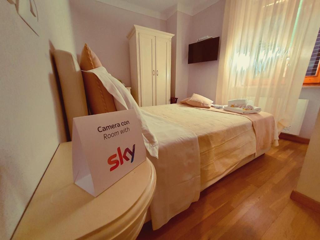 Postel nebo postele na pokoji v ubytování Hotel Volterra In Superior