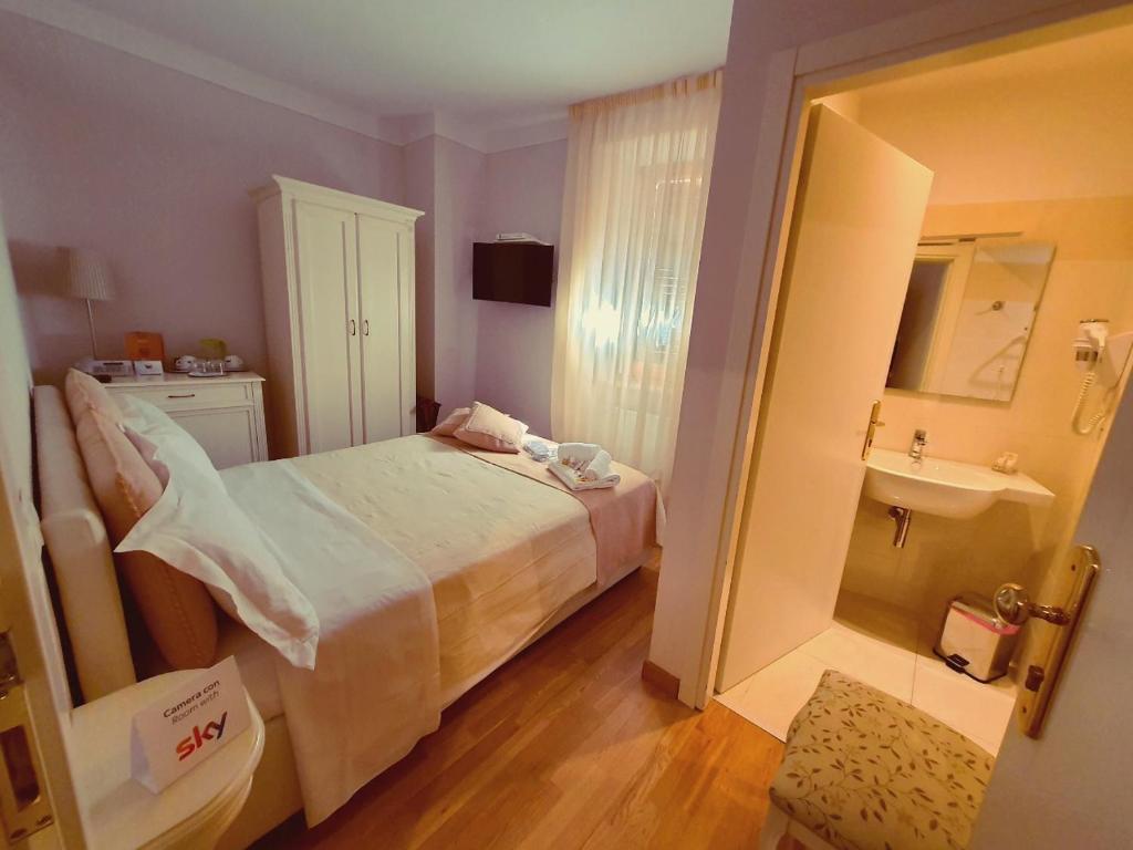 Postel nebo postele na pokoji v ubytování Hotel Volterra In Superior