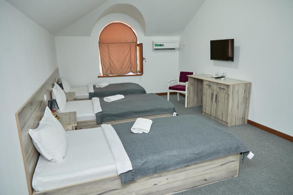 Ένα ή περισσότερα κρεβάτια σε δωμάτιο στο Hotel Muqaddas