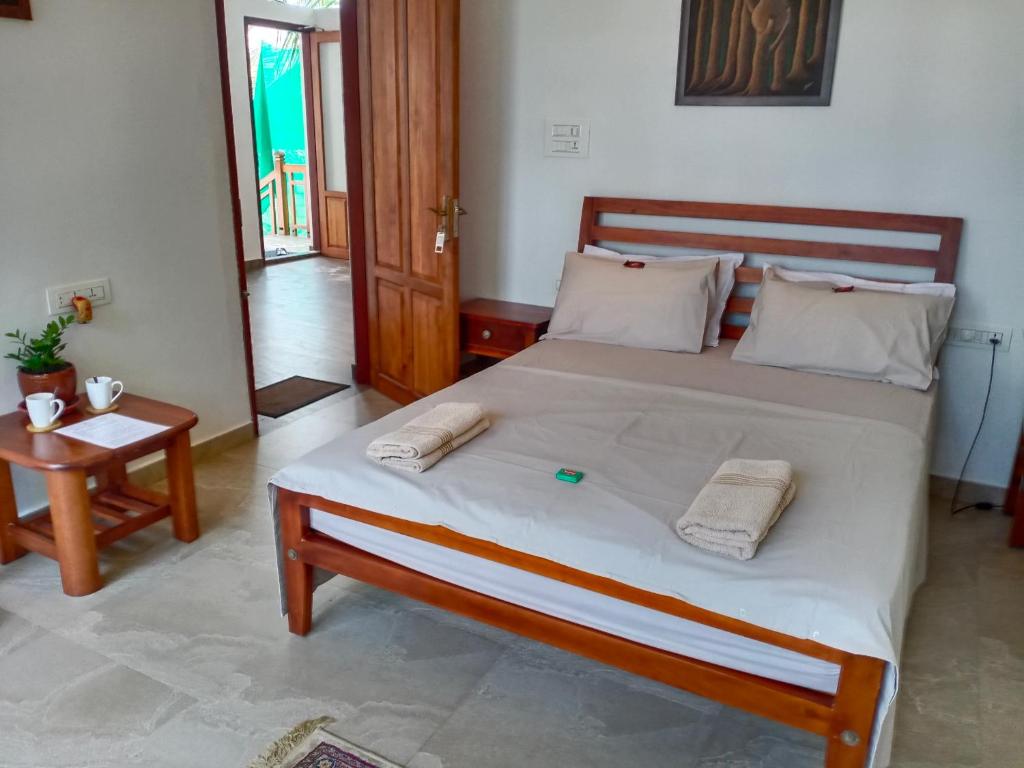 Katil atau katil-katil dalam bilik di Neela Waters - Beach Home