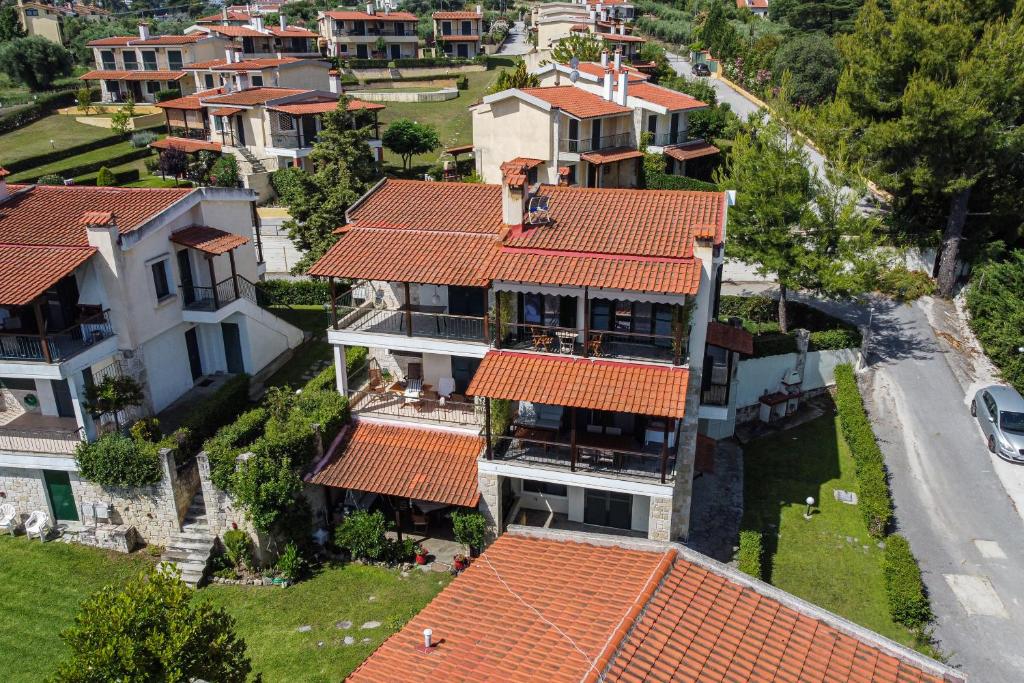 an aerial view of a house with red roofs at Dekalo Seaside Villa, Kriopigi in Kriopigi