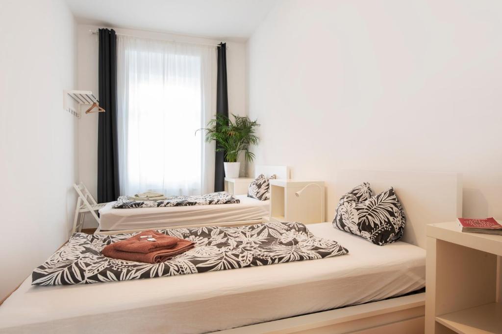 Posteľ alebo postele v izbe v ubytovaní City-Apartments Graz