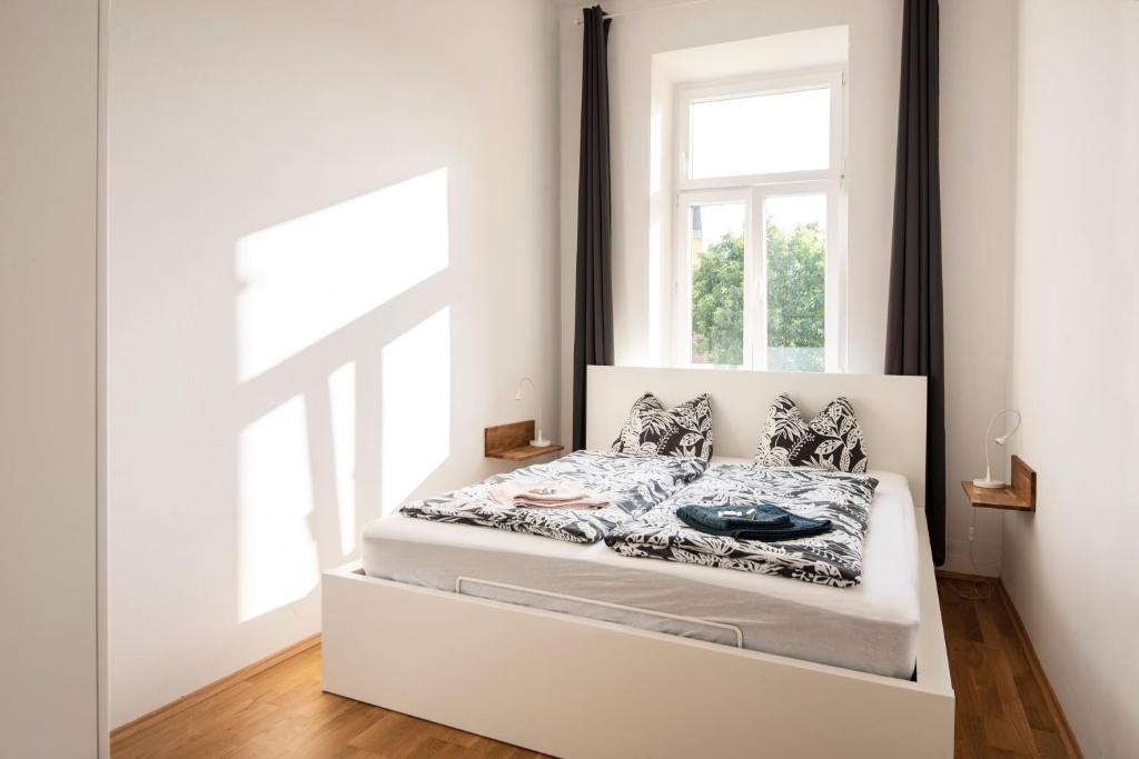 Posteľ alebo postele v izbe v ubytovaní City-Apartments Graz