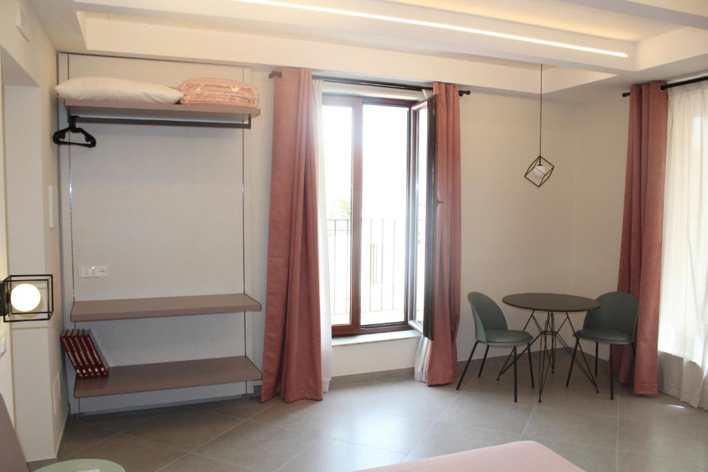 Postel nebo postele na pokoji v ubytování Margiò House