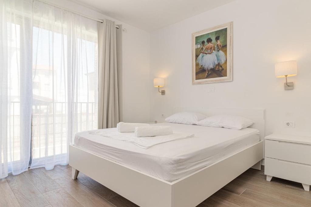 Postel nebo postele na pokoji v ubytování Apartments Anna Liznjan