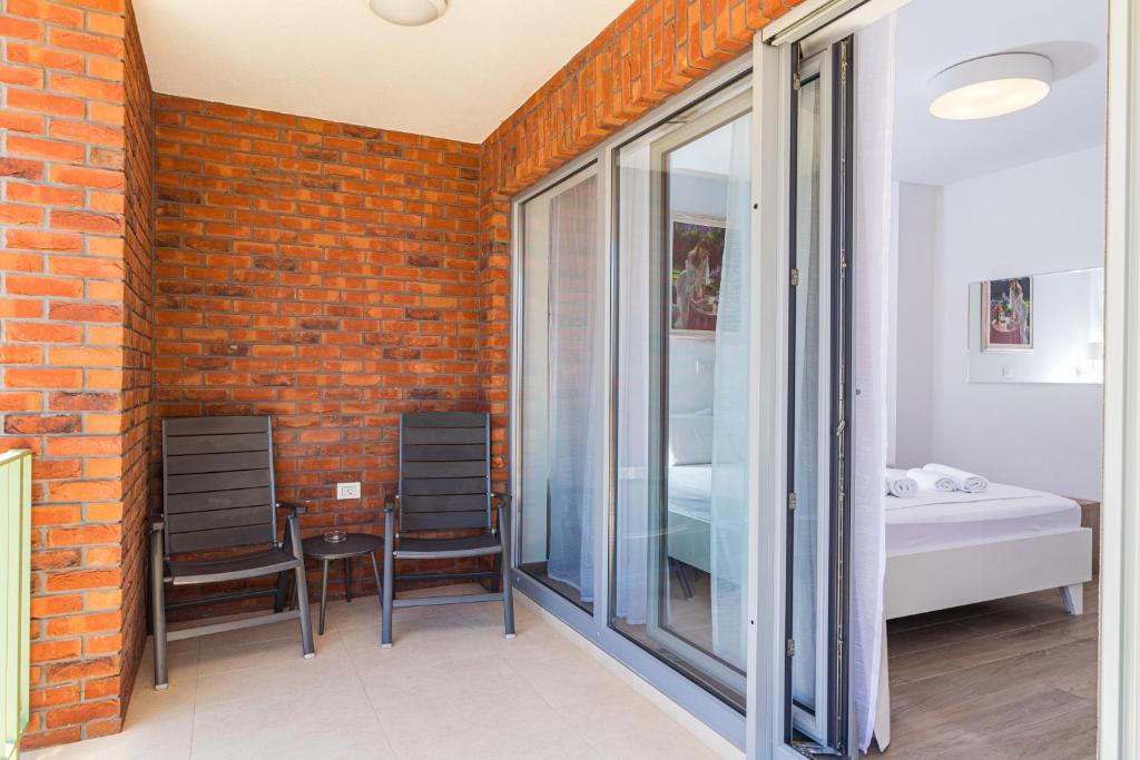 Postel nebo postele na pokoji v ubytování Apartments Anna Liznjan