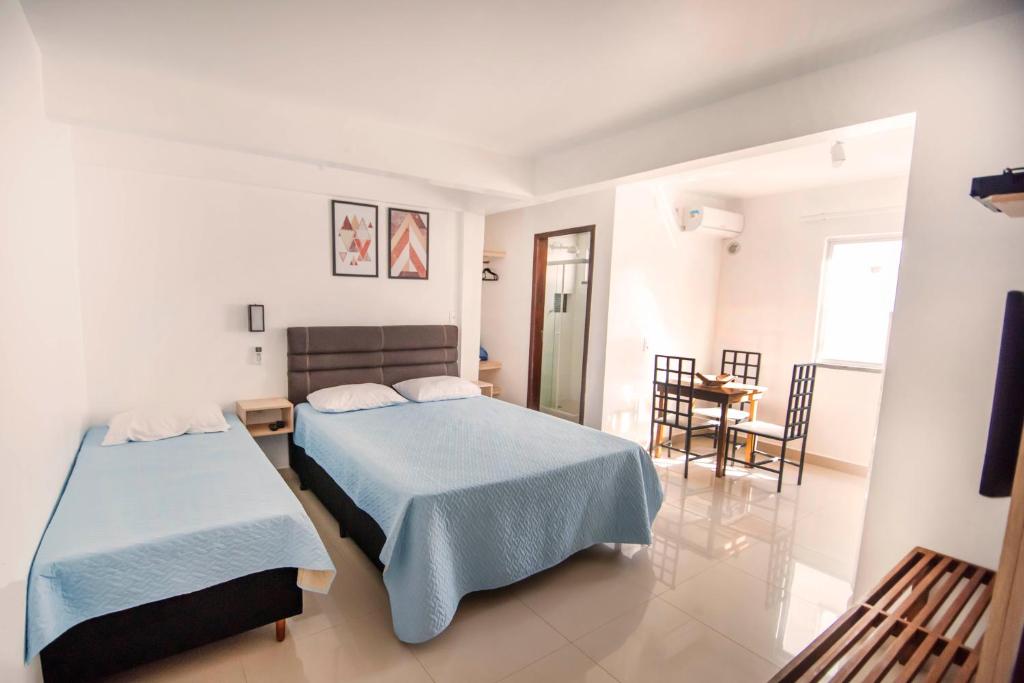 Ένα ή περισσότερα κρεβάτια σε δωμάτιο στο Pousada Casa de Praia