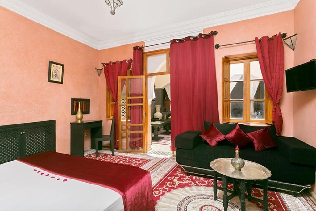 Postel nebo postele na pokoji v ubytování Arabian Riad Marrakech
